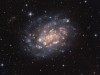 APOD - NGC 300: A Cosmic Gemstone with Stars and Gas Clouds