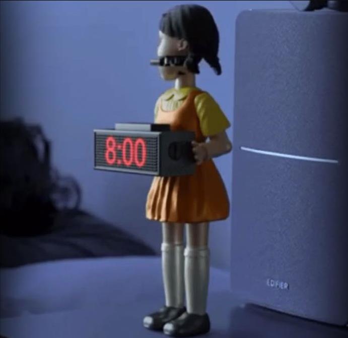 dudeiwantthat.com squid-game-doll-shooting-alarm-clock.jpg